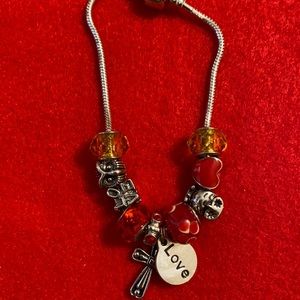 Red and white charm bracelet.